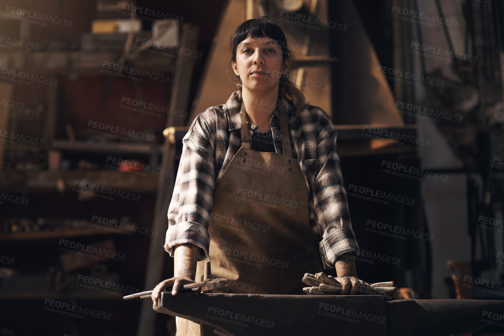 Buy stock photo Foundry, workshop and portrait of woman with tools for industry, manufacturing and manual labor. Industrial factory, welding and female person for steel, iron and metal production for craftsmanship