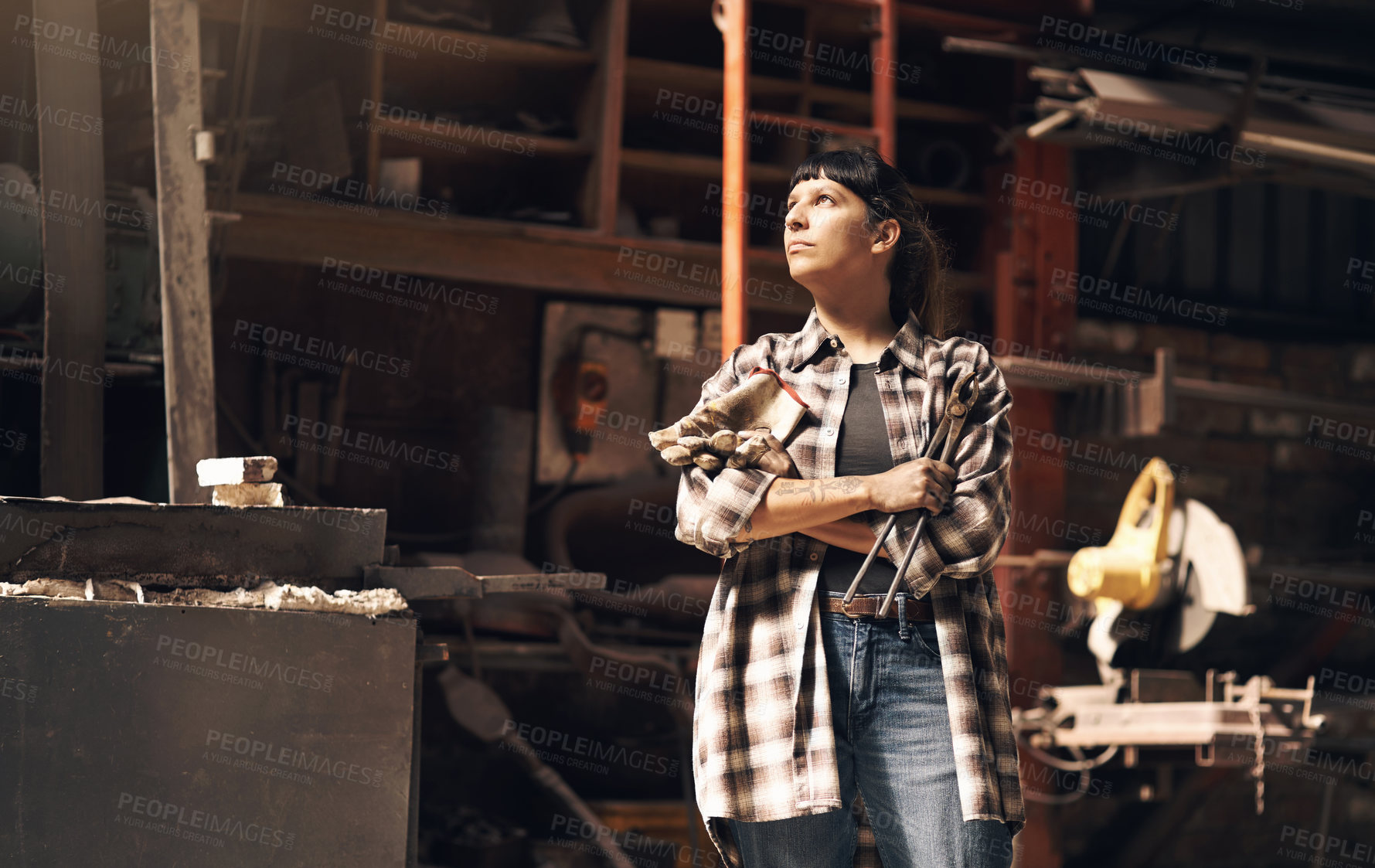 Buy stock photo Woman, blacksmith and machine at metal factory for foundry industry, manufacturing and hardware steel production. Thinking, welder and ideas for iron welding, design and planning crafting for trade