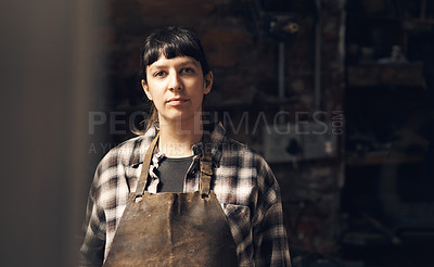 Buy stock photo Woman blacksmith, portrait and workshop at factory, trade or artisan job for entrepreneurship. Small business owner, female entrepreneur or labor in manufacturing, industrial warehouse or metalwork