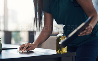 Buy stock photo Closeup shot of an unrecognisable businesswoman cleaning a workspace in an office