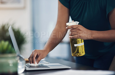 Buy stock photo Closeup shot of an unrecognisable businesswoman cleaning a laptop in an office