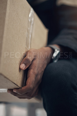 Buy stock photo Cropped shot of a man delivering a package to a place of residence