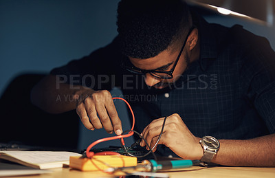 Buy stock photo Shot of a young technician repairing computer hardware