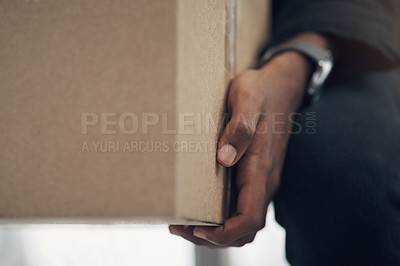 Buy stock photo Cropped shot of a man delivering a package to a place of residence