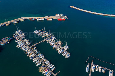 Buy stock photo High angle, boats and harbour with ocean, port and marina for travel or cruise holiday. Top view, dock and sea with sailboat, nautical pier or jetty with water scenery and panorama background