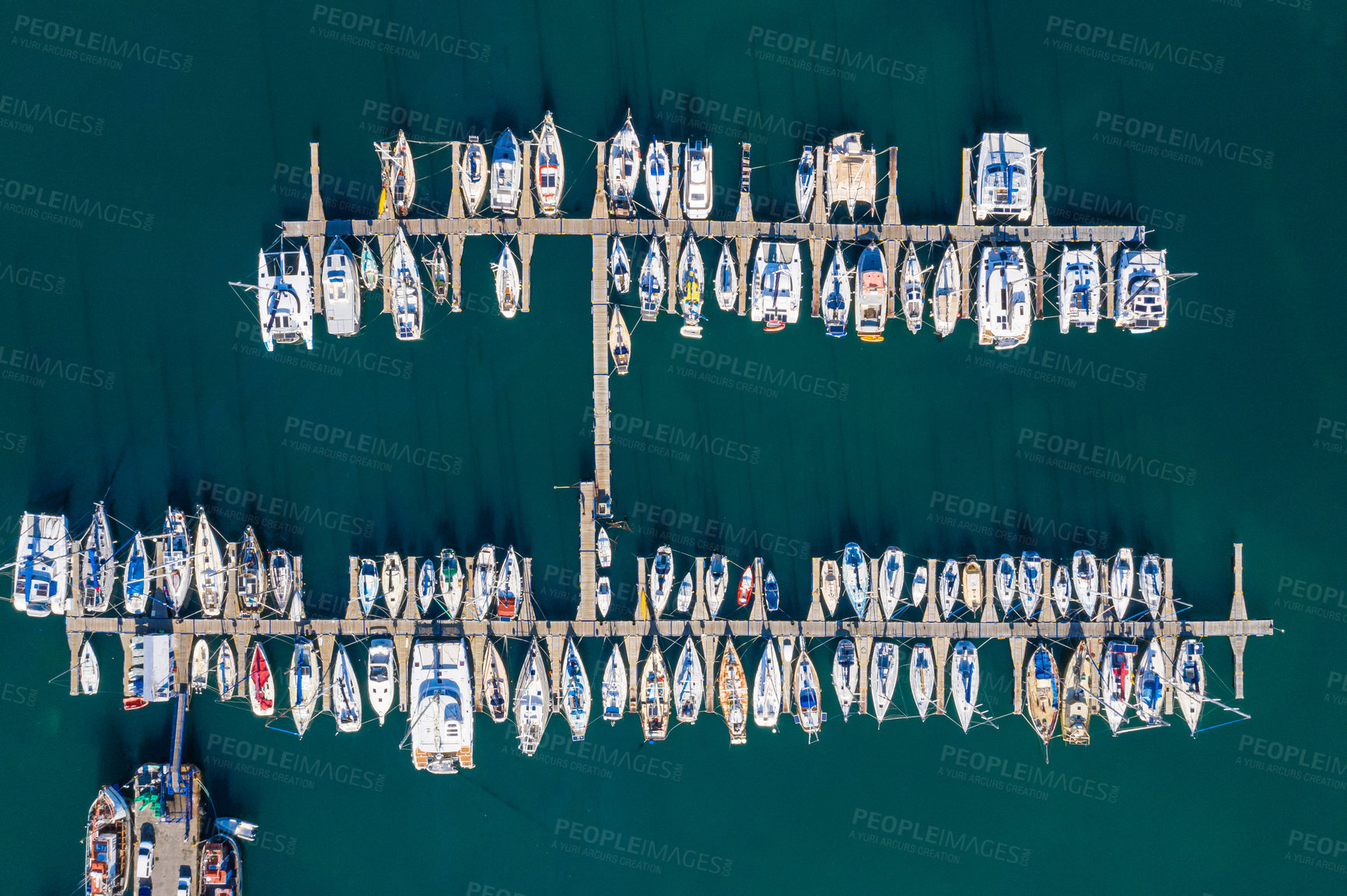 Buy stock photo High angle shot of boats at a seaside harbour