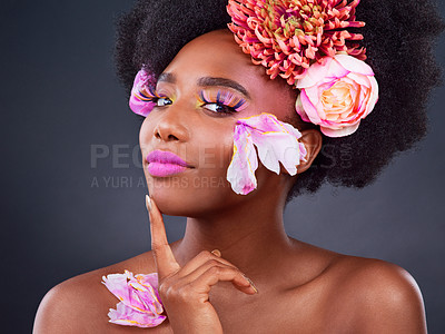 Buy stock photo Flowers, portrait and skincare with afro black woman in studio on dark background for natural cosmetics. Beauty, face or makeup and young model with protea in hair for aesthetic wellness at spa