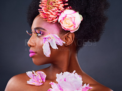 Buy stock photo Flowers, makeup and black woman with beauty, cosmetics and dermatology on dark studio background. African person, shine and model with natural treatment, grooming and floral texture with vibrant glow