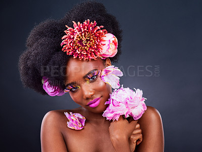 Buy stock photo Beauty, flowers and portrait of natural black woman in studio on dark background for cosmetics. Face, makeup or skincare and young afro model with protea in hair for aesthetic wellness at spa