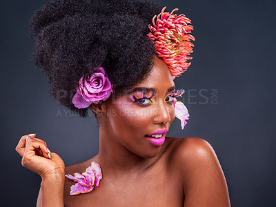 Buy stock photo Makeup, flowers and black woman portrait in studio for organic beauty on black background. Floral, face and African female model pose with eco friendly, natural and cosmetics with isolated mockup 