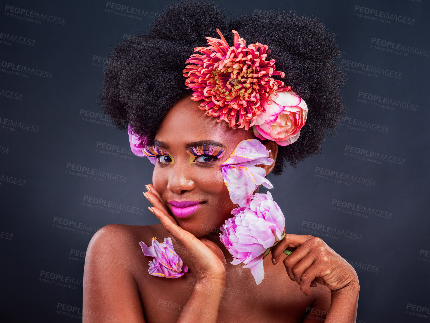 Buy stock photo Beauty, portrait and spring flowers with black woman in studio on dark background for natural cosmetics. Afro, face or makeup and young model with protea plant in hair for aesthetic wellness at spa
