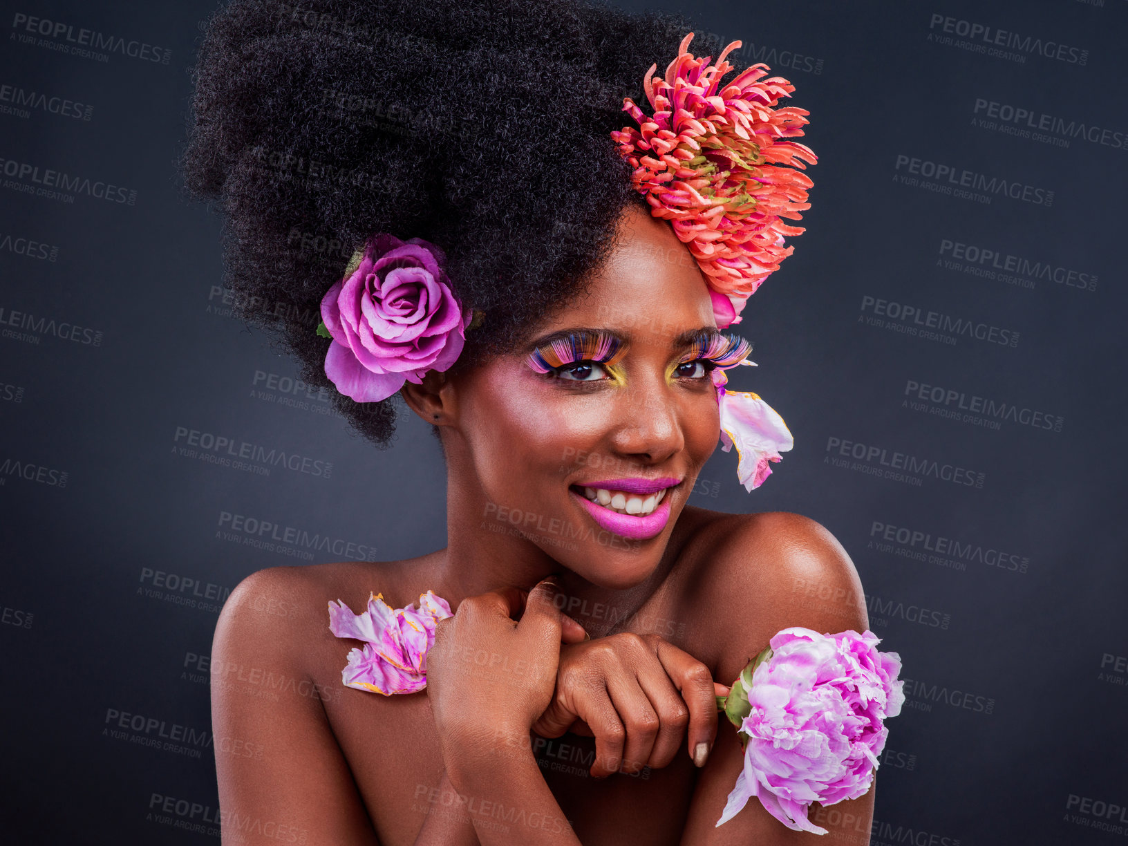 Buy stock photo Beauty, flowers and smile of afro black woman in studio on dark background for natural cosmetics. Face, makeup or thinking and happy young model with protea in hair for aesthetic wellness at spa
