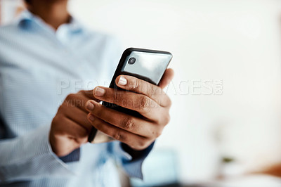Buy stock photo Cropped sot of an unrecognisable businesswoman using a smartphone