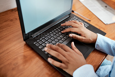 Buy stock photo Cropped shot of a businesswoman using a laptop at her desk