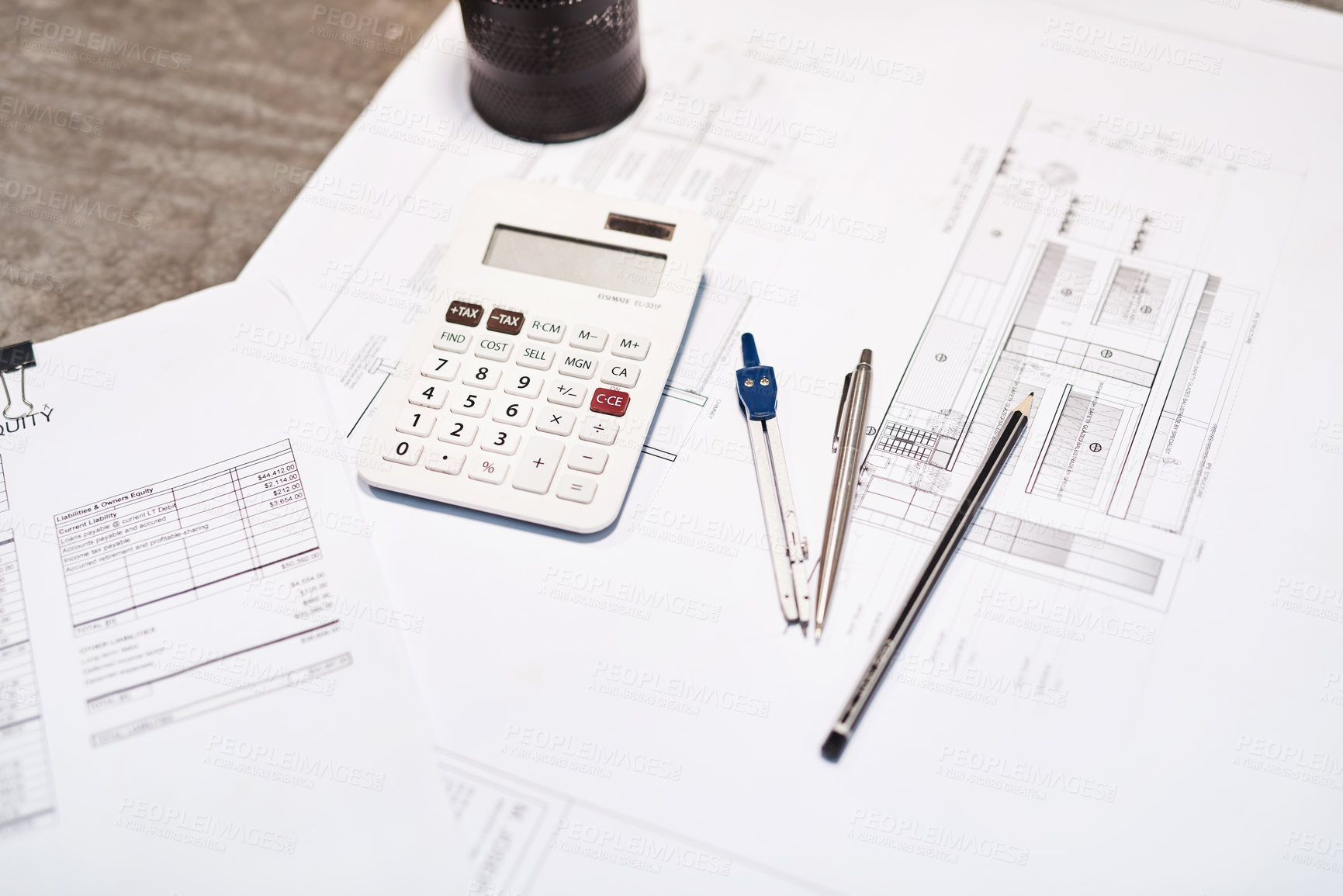 Buy stock photo Shot of a calculator, pencil, blueprint and compass on a desk in an office