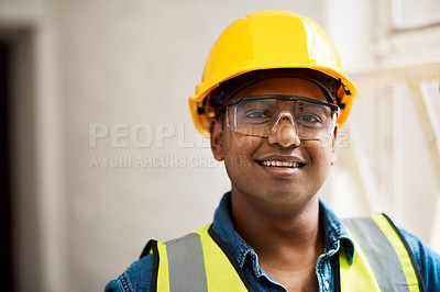 Buy stock photo Shot of a engineer wearing protective gear on a construction site