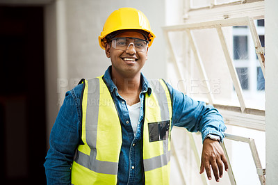 Buy stock photo Shot of a engineer wearing protective gear on a construction site