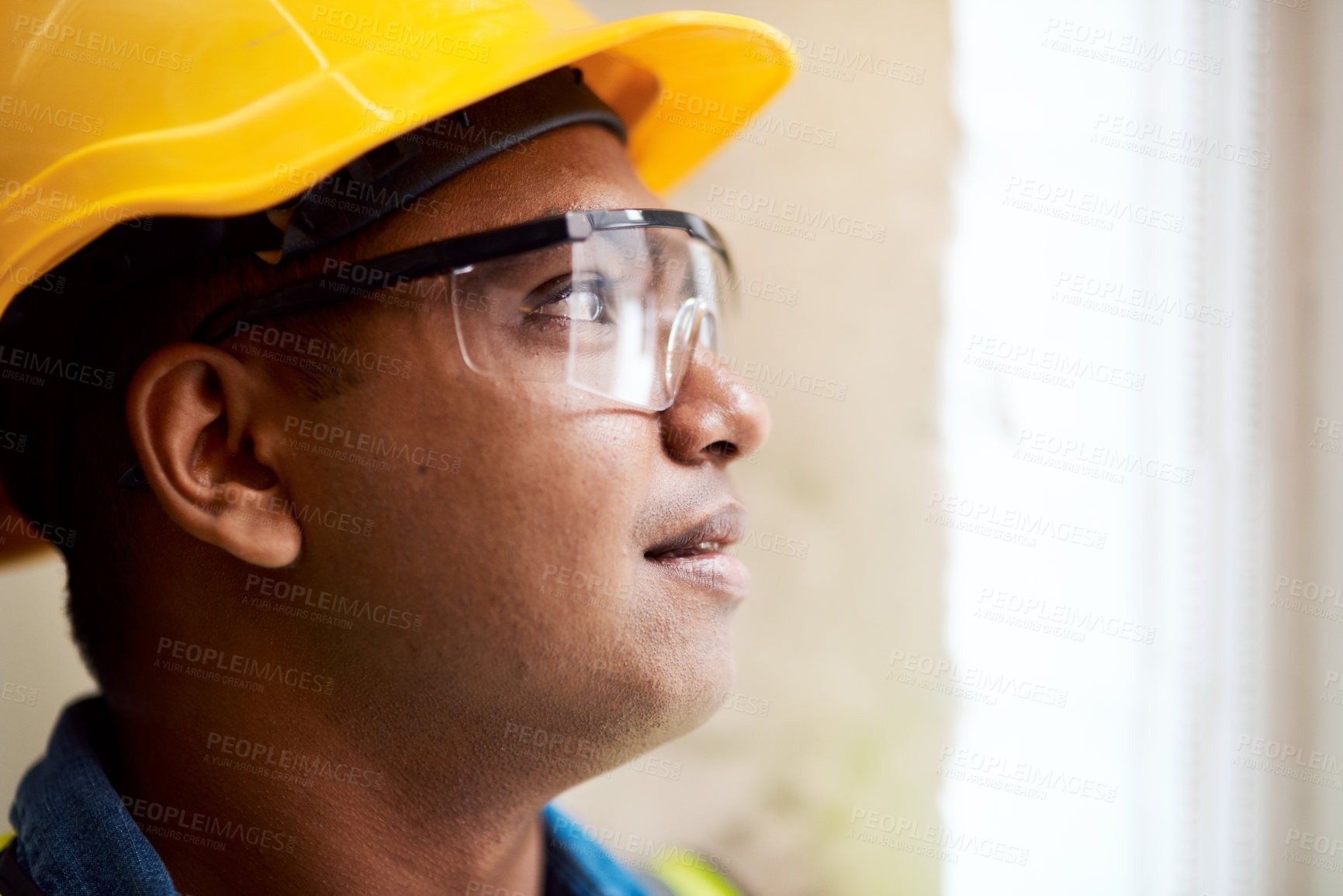 Buy stock photo Shot of a engineer wearing protective gear on a construction site