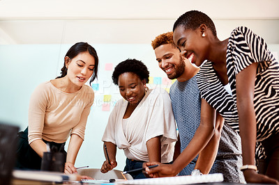 Buy stock photo Shot of a group of young creatives working together in an office