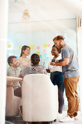 Buy stock photo Shot of a group of young creatives working together in an office