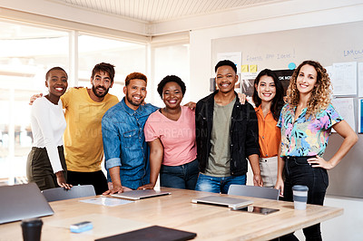 Buy stock photo Cropped portrait of a group of young designers standing in the boardroom of their office