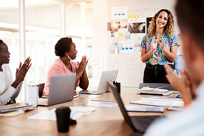 Buy stock photo Cropped shot of a group of young designer applauding during a meeting in the boardroom