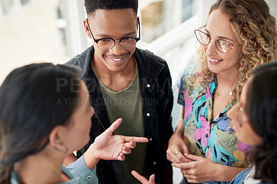 Buy stock photo High angle shot of a group of businesspeople having a discussion in an office