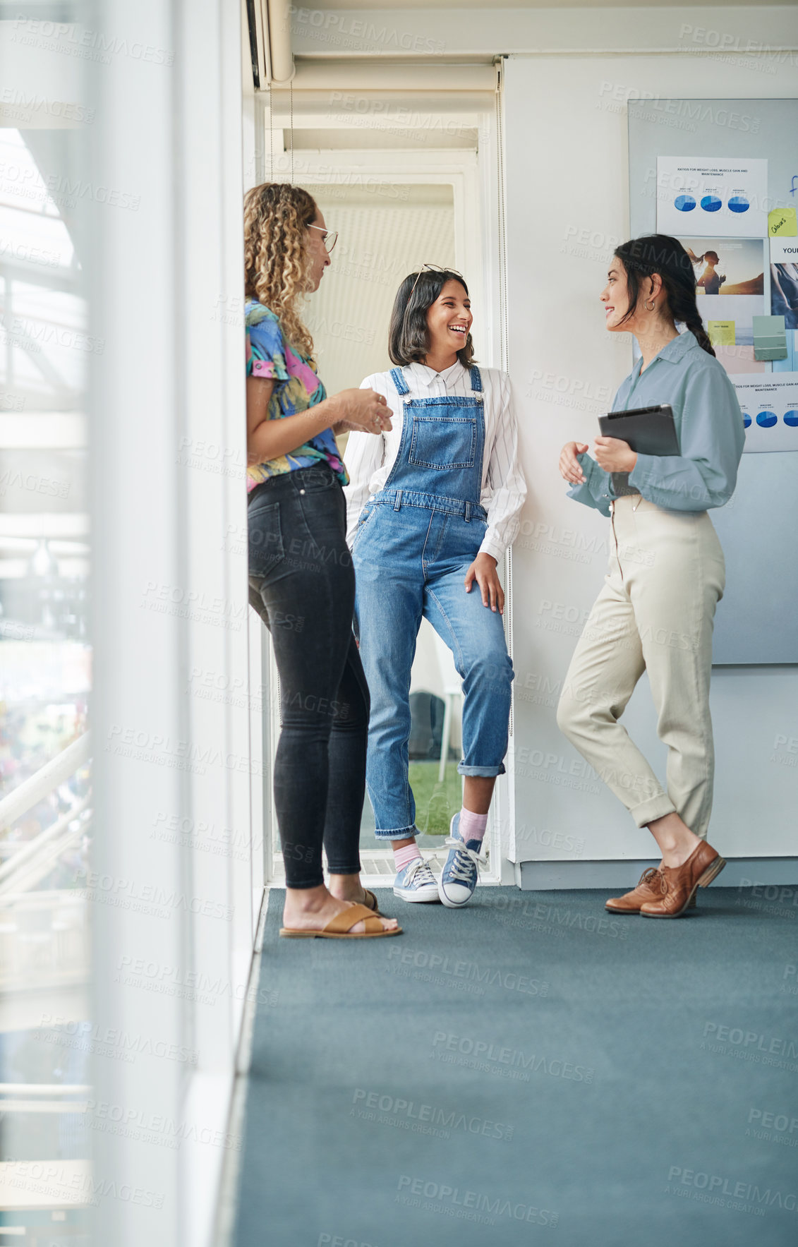 Buy stock photo Shot of a group of businesswomen having a discussion in an office