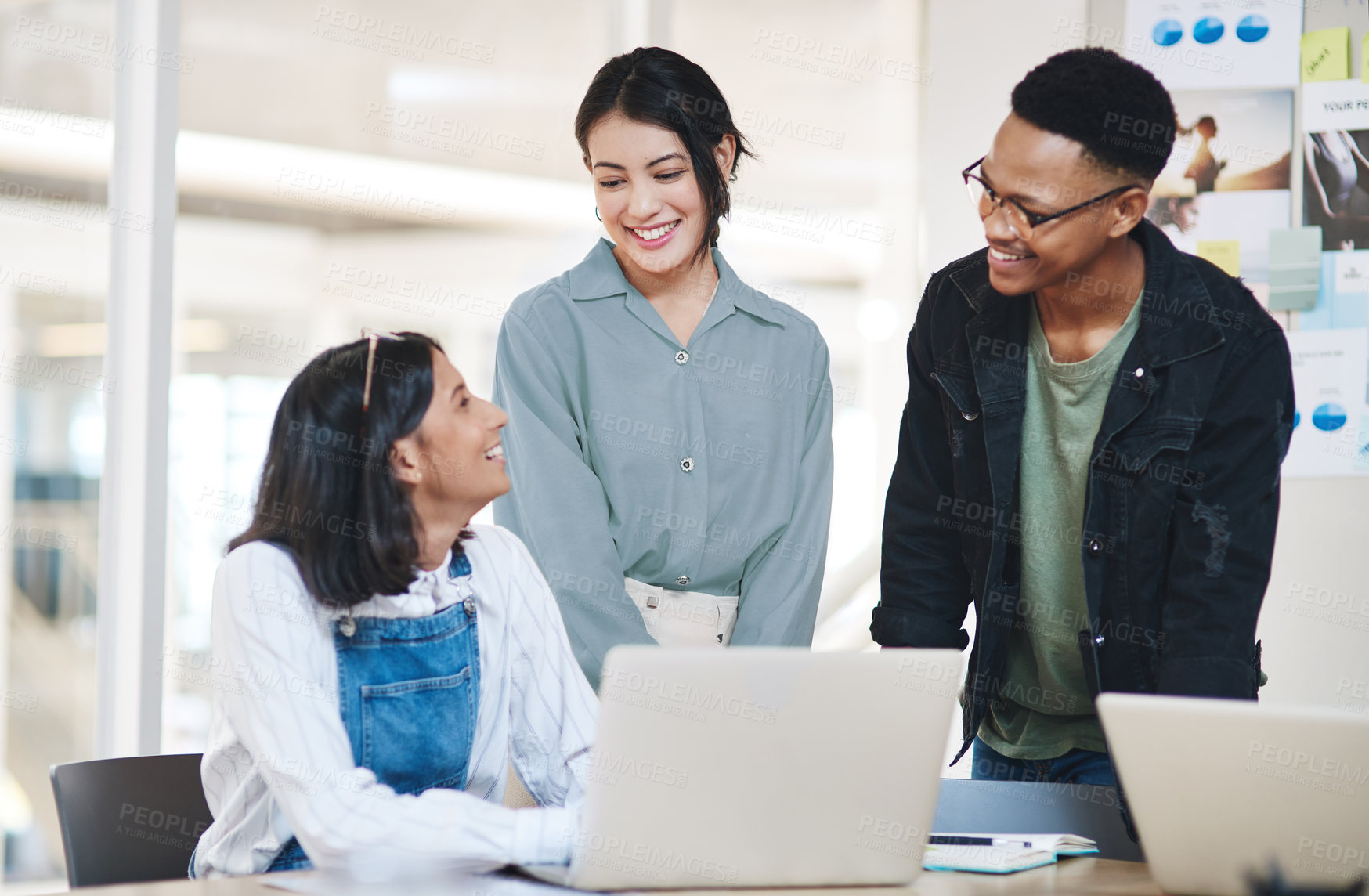 Buy stock photo Shot of a group of businesspeople working together in an office