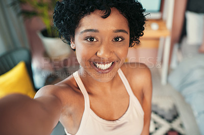 Buy stock photo Portrait shot of a young woman taking selfies at home