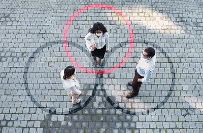 Buy stock photo Shot of a group of people wearing masks in the city with circles around them indicating Covid-19 tracing and transmission