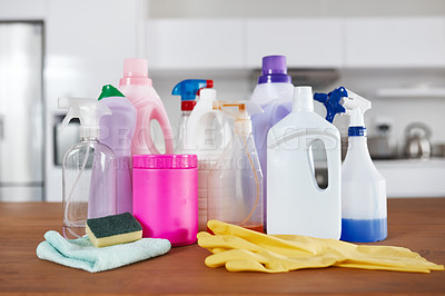 Buy stock photo Shot of various cleaning products on a table in the kitchen at home