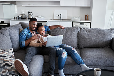 Buy stock photo Couple, laptop and watch movie while lying on the living room couch for relaxation. Internet, pc and online social media browsing with an african american man and woman using a laptop for streaming