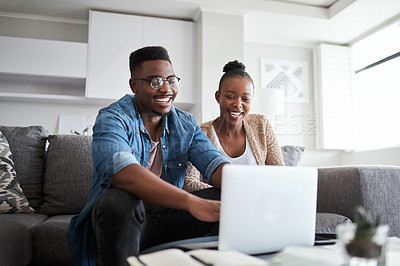 Buy stock photo Black couple, laptop and planning finance budget, bills and loan with network connection or home wifi on living room couch. Man and woman on social media, banking website or doing online shopping