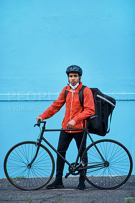 Buy stock photo Shot of a delivery man out with his bicycle