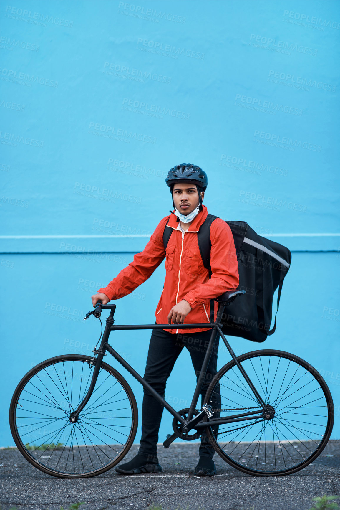 Buy stock photo Shot of a delivery man out with his bicycle