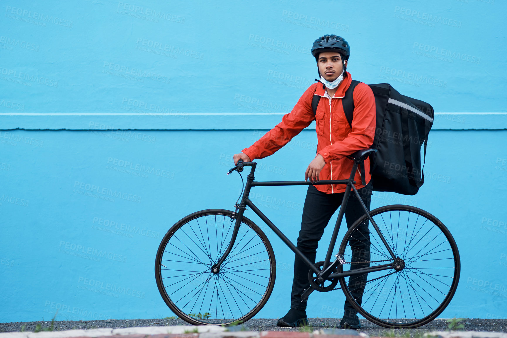 Buy stock photo Shot of a delivery man out with his bicycle