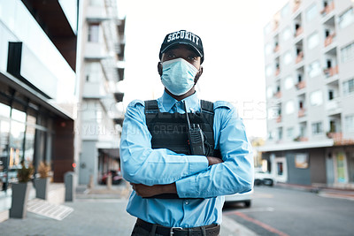 Buy stock photo Portrait of a confident masked young security guard standing guard outdoors