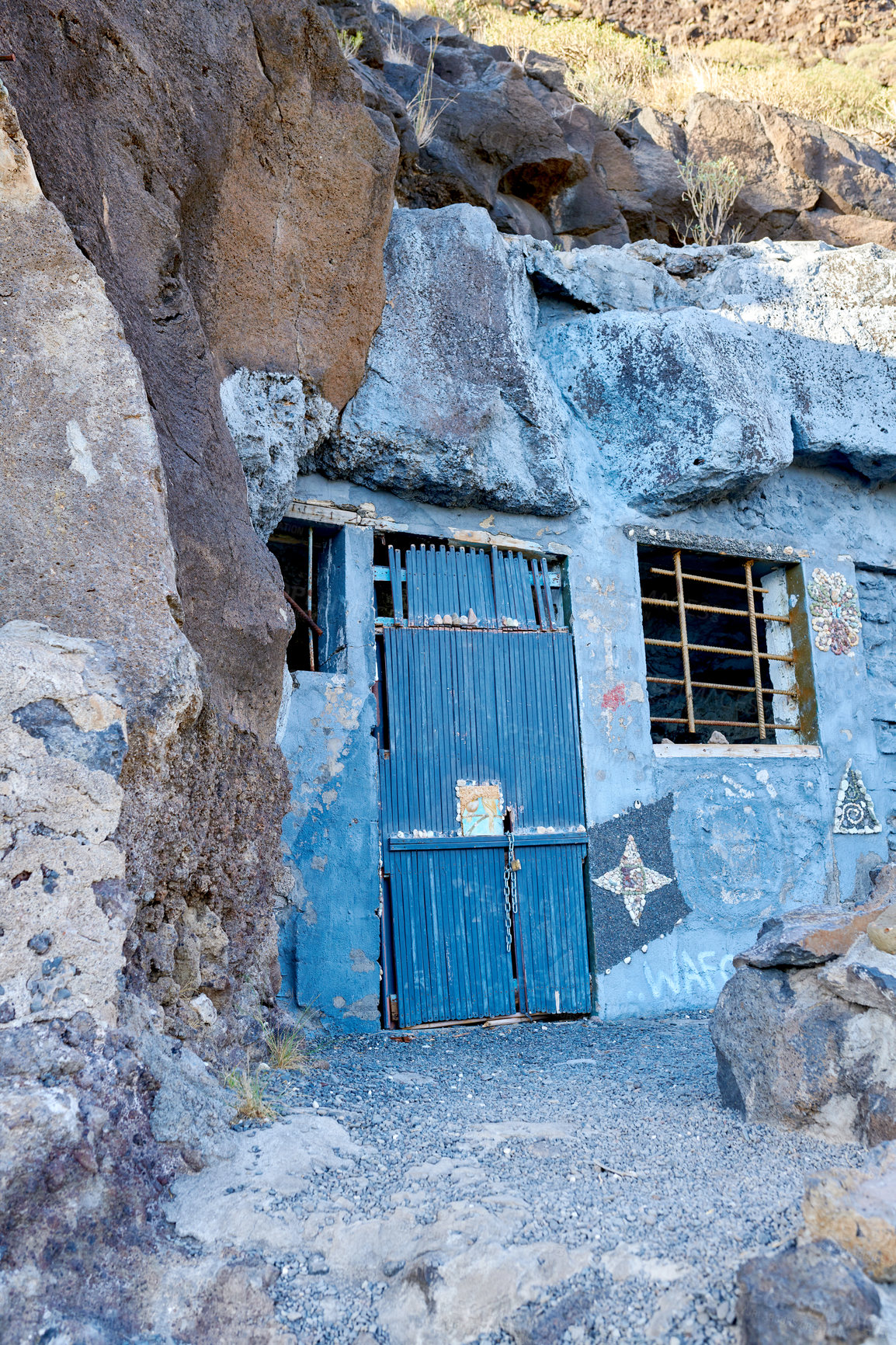 Buy stock photo Abandoned cave house with a wooden blue door close to Lol Llanos, La Palma, Canary Islands. Rustic, vintage, broken and aged entrance to a vacant home in a small village or town on a historical site
