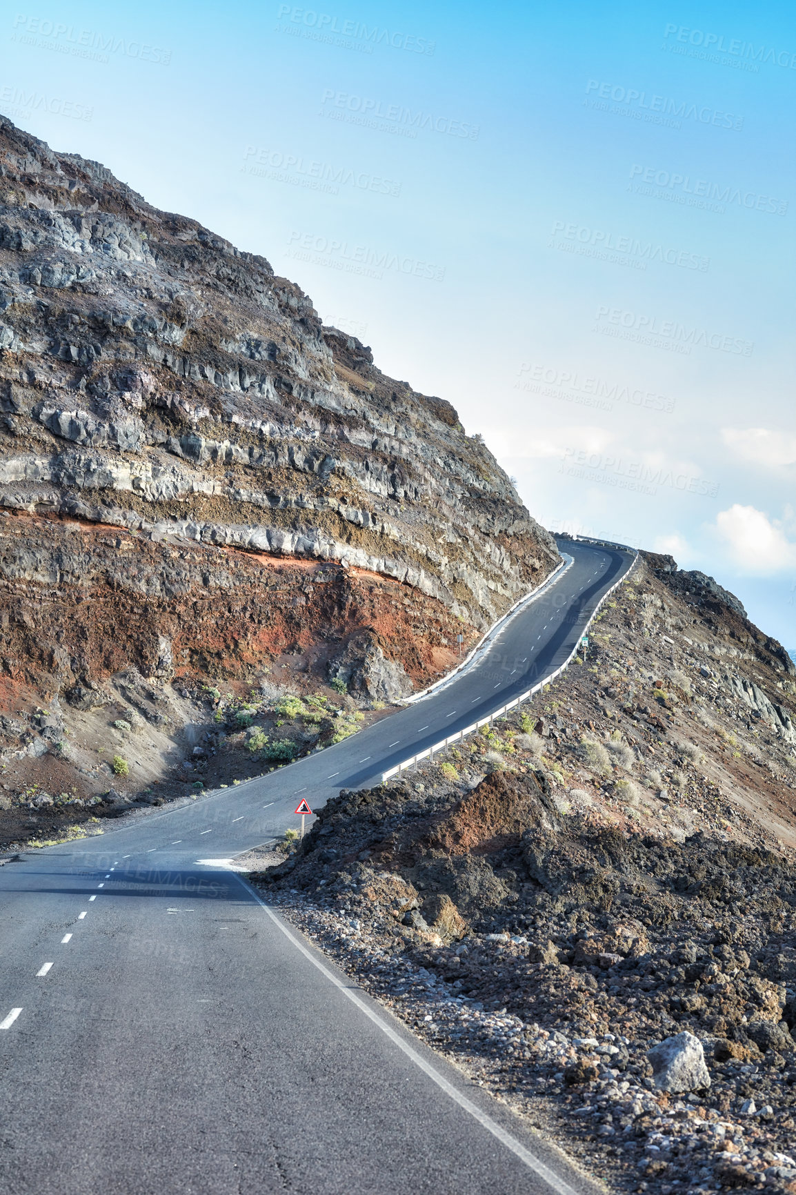 Buy stock photo Empty road in the mountains with a clear blue sky. Landscape of a countryside roadway for traveling on a mountain pass along a beautiful scenic nature drive in La Palma, Canary islands in Spain 