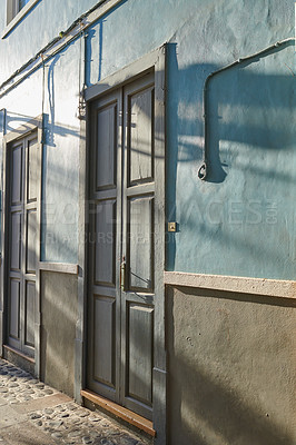 Buy stock photo Historic Spanish architecture outdoors of a building in a overseas. Backdoor of a home or residential building. Two old blue doors to a traditional house outside in Santa Cruz de La Palma, Spain.