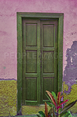 Buy stock photo Vintage, aged structure with architectural details on moss covered walls in an urban town in Spain. A door at an entrance of an old fashioned rustic building in Santa Cruz, de La Palma.