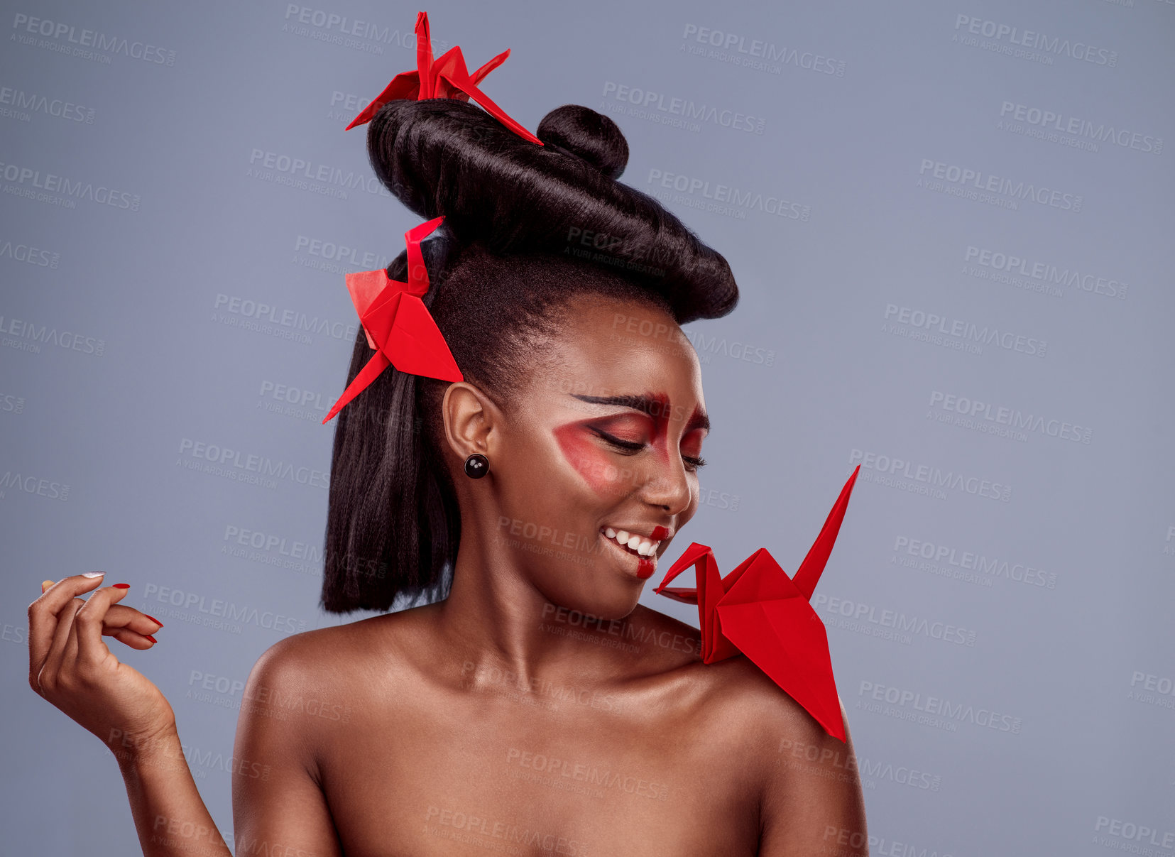 Buy stock photo Style, culture and origami with black woman in studio isolated on gray background for tradition. Beauty, bird and smile with happy African model in makeup for cosmetics, fusion and inspiration