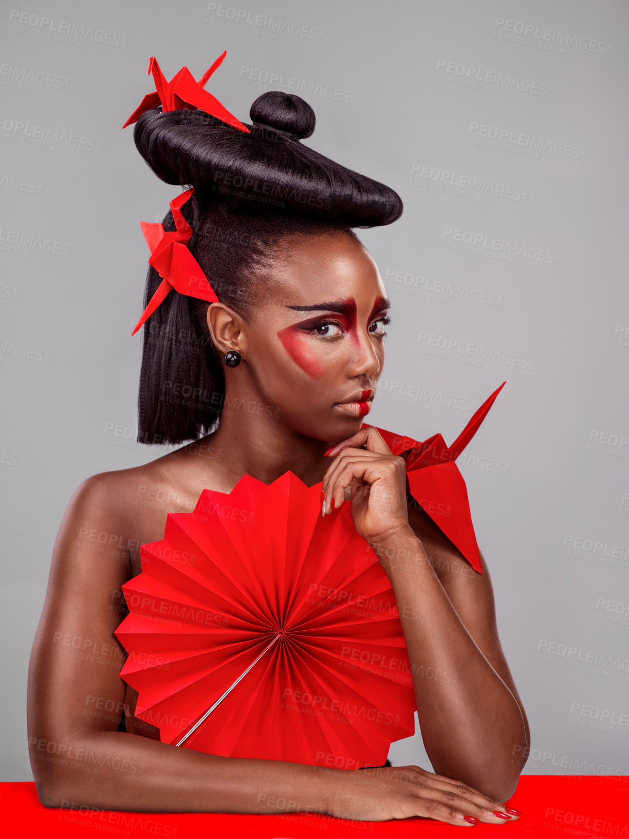 Buy stock photo Portrait, beauty and black woman with origami for fashion, makeup and skin art in studio isolated on gray background. Face, creative cosmetics and confident model thinking of paper crane in hair