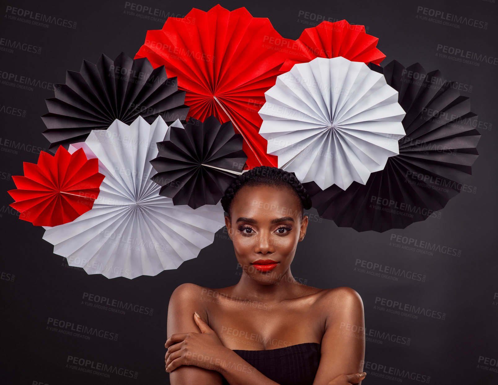 Buy stock photo Origami fans, portrait and a black woman for culture isolated on a black background in a studio. Paper, creative and an African model with art design for tradition, color and Japanese celebration