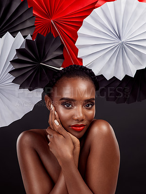 Buy stock photo Portrait, beauty and black woman with origami fans in studio isolated on a dark background. Natural face, makeup cosmetics and skincare of female model with traditional Japanese paper art for culture