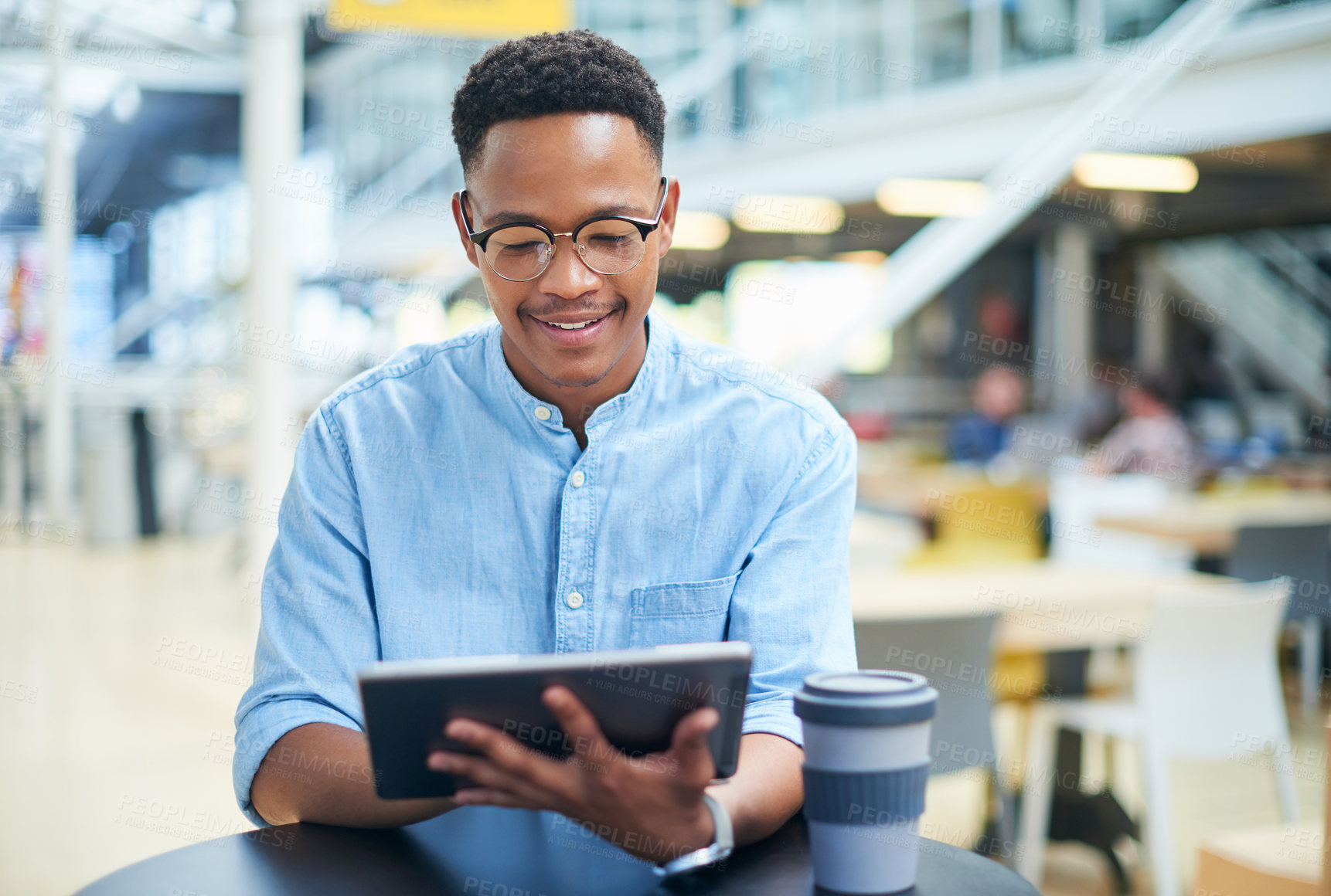 Buy stock photo Black man, tablet and coffee break in office, relax and professional on social media app for news. Male person, communication and employee on website for reading message, typing and tea for info