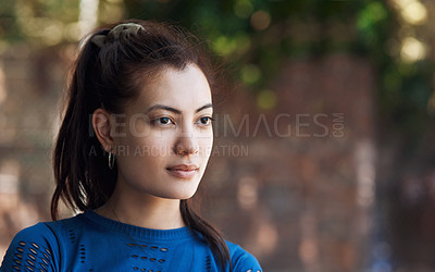 Buy stock photo Cropped shot of an attractive young female athlete standing on the basketball court