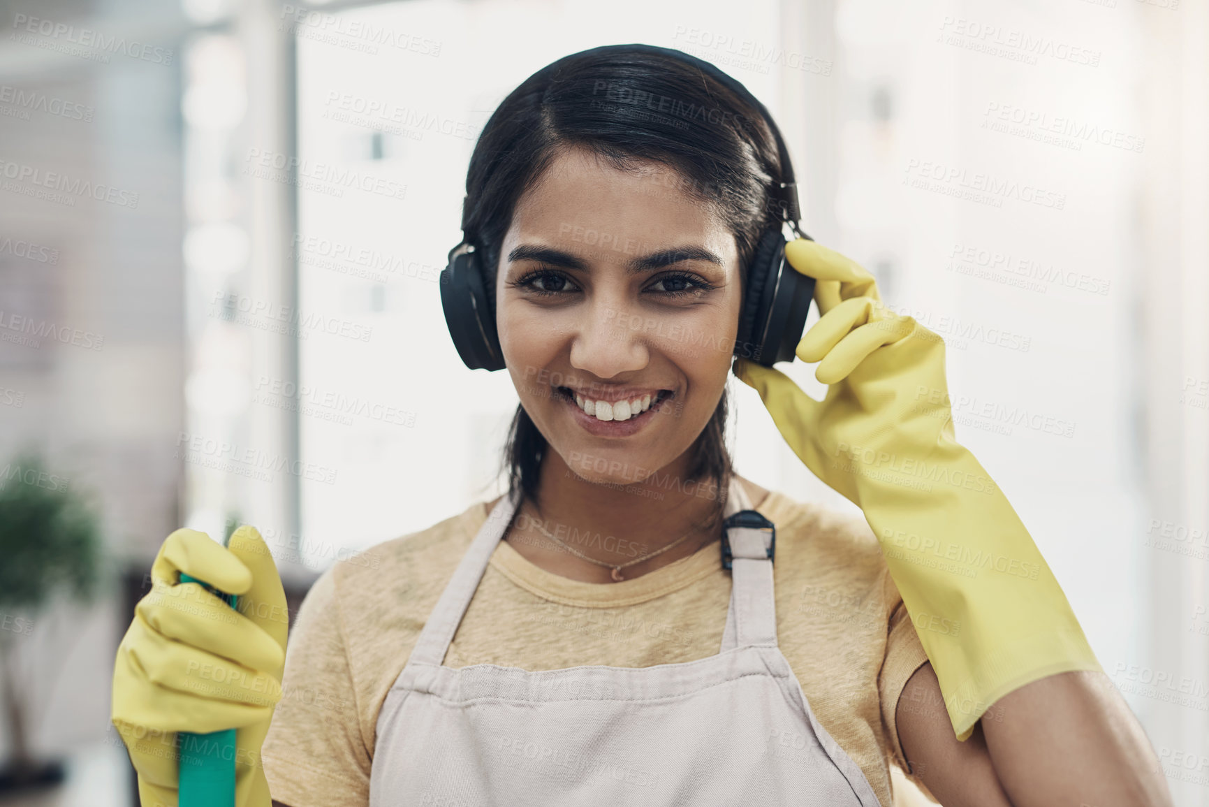 Buy stock photo Happy woman, portrait and maid with headphones for music, cleaning or chores at home. Female person, cleaner or housekeeping with smile, sound or gloves for hygiene, house work or listening to audio