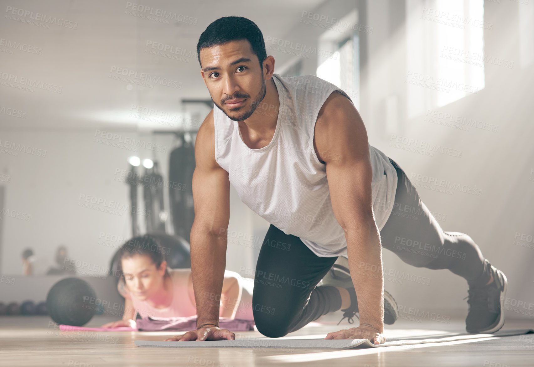 Buy stock photo Shot of a young male athlete working out at the gym